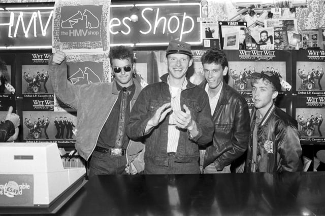 Scottish band Wet Wet Wet signing records at the HMV shop in September 1987. L-R: Marti Pellow, Tommy Cunningham, Graeme Clark and Neil Mitchell.
