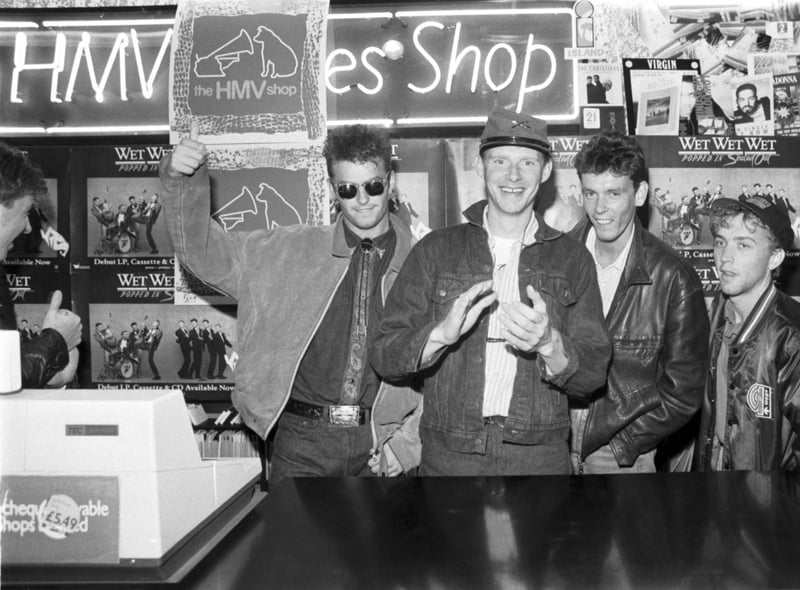 Scottish band Wet Wet Wet signing records at the HMV shop in September 1987. L-R: Marti Pellow, Tommy Cunningham, Graeme Clark and Neil Mitchell.
