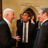 Rishi Sunak and Keir Starmer talk with Commons Speaker Lindsay Hoyle ahead of a reception for King Charles and Queen Camilla at Westminster Hall (Picture: Arthur Edwards/pool/AFP via Getty Images)