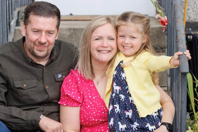 Proud mum Claire-Ann Thomson with husband and daughter