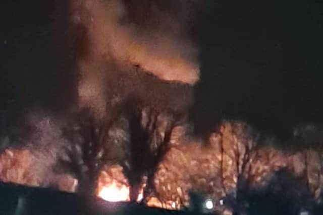 Smoke can be seen billowing from the blaze behind the trees as a local captures the fire at Bo'ness Bowling Club on Thursday night, April 15 (Photo: Tina Paterson).
