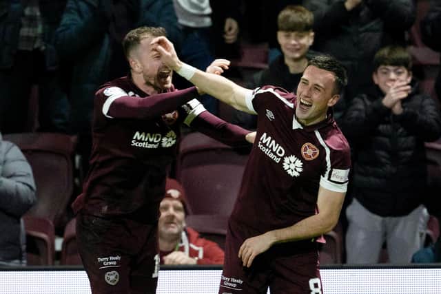 Aaron McEneff and Andy Halliday celebrate the Irishman's goal for Hearts against St Mirren.