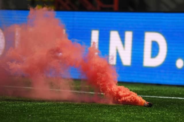 The smoke bomb thrown on to the pitch at New Douglas Park during Hearts' Scottish Cup win over Hamilton Accies. Picture: SNS