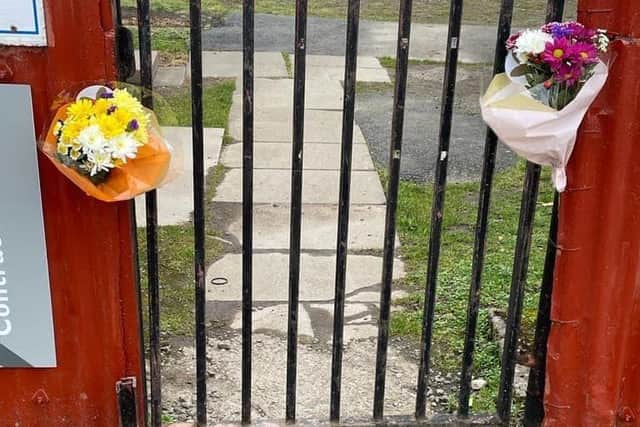Flowers left at the entrance to Arniston Rangers's Newbyres Park