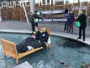 Extinction Rebellion protesters gathered outside the Scottish Parliament, with two activists dressing as an MSP and BP respectively, in order to criticise the 'overly cosy relationship between the company and decision-makers'.