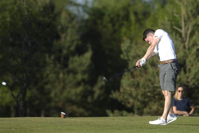 A golfer tees off at the Braids, where members of the affiliated clubs based at the course are being impacted by the change to how tee times are booked. Picture: TSPL