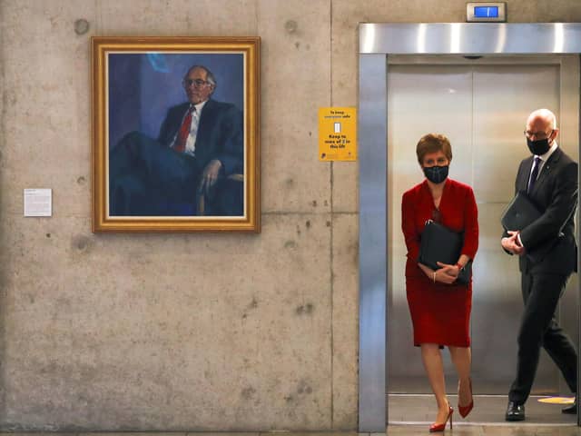 Nicola Sturgeon, exiting a lift in the Scottish Parliament, has laid out a skeleton route map out of Covid lockdown.