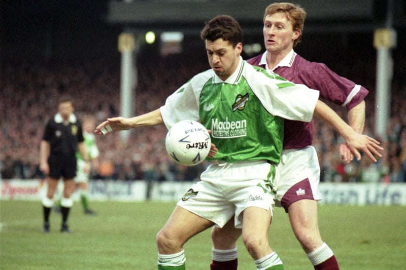 Hibs' Pat McGinlay shields the ball from opponent Ally Mauchlen during a Hibs v Hearts Edinburgh Derby football match on New Year's Day 1993. Final score 0-0 draw.