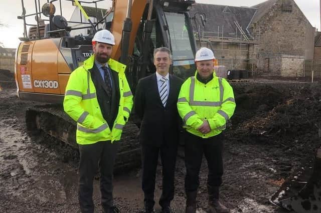 In the picture from left to right are: Richard Crowther, Commercial Director at Cruden Building Scotland, Midlothian Council's Cabinet Member for Housing Cllr Stuart McKenzie and Project Manager Scott Walker.