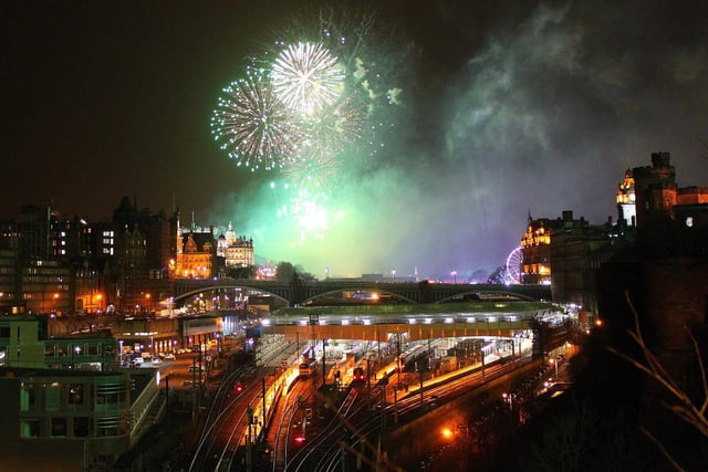 The Edinburgh Hogmanay Fireworks 2012, from St Andrew House looking over North-Bridge and Waverley Train-Station and Edinburgh Old Town.