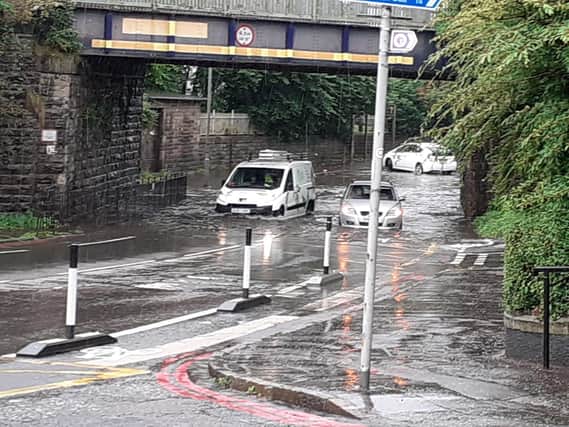 At Slateford Railway Bridge, many cars have had to turn around and avoid the area due to a deep puddle engulfing the road under the bridge (Photo: Sam Shedden).