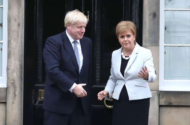 Boris Johnson and Nicola Sturgeon both don't seem to understand the severity of the cost-of-living crisis (Picture: Jane Barlow/PA)