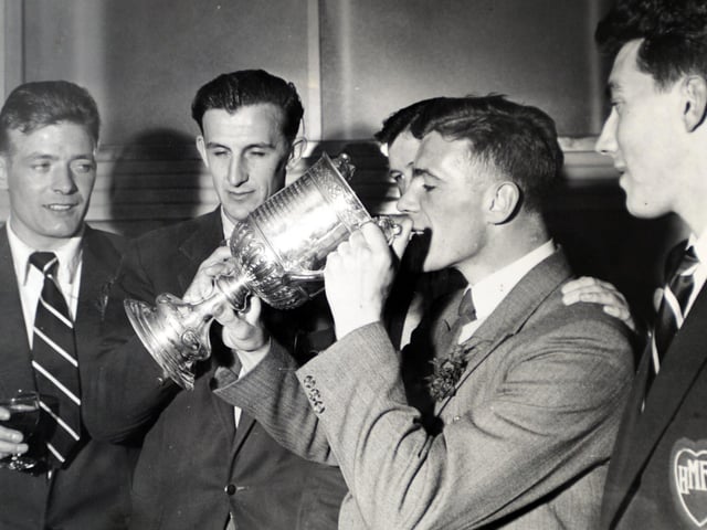 Freddie Gidden, from Broxburn, captained the cup-winning Hearts team in 1956. Pictured is a photograph from 1956 of Freddie drinking out of the cup.