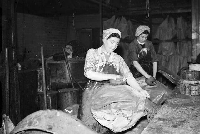 Workers hand proofing sea buoys at the Daniel Buchanan and Sons Ltd plastics factory in Prestonpans in August 1957.