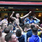 Football fans in London ahead of the Scotland v England Euros game.