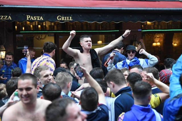 Football fans in London ahead of the Scotland v England Euros game.