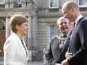 Frank Ross, seen with Prince William and Nicola Sturgeon, had planned to climb a Munro if he lost in the elections (Picture: Jane Barlow/WPA pool/Getty Images)