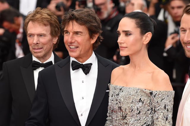 Tom Cruise and Jennifer Connelly attend the Top Gun: Maverick premiere at during the 75th Cannes Film Festival in Cannes.