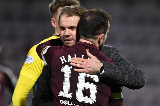 Hearts manager Robbie Neilson embraces Andy Halliday at full-time after his side defeated Ross County 2-1. Picture: SNS