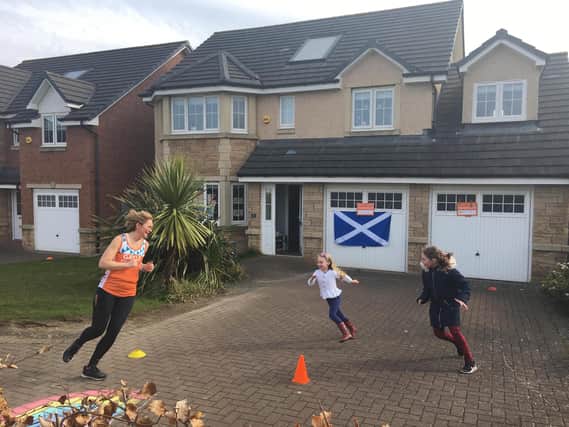 Gayle Hoy ran 655 laps of her driveway to complete the marathon