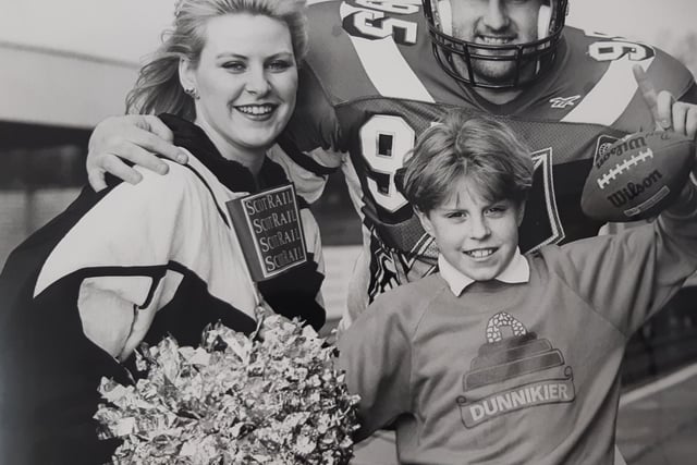 Spreading the Claymores message at Kirkcaldy Station is player Don Edmonson, who also played with Fife 49ers. 
He is pictured with cheerleader Ruth Hunter Pepper and Marc Anderson, a P7 pupil at Dunnikier Primary School in Kirkcaldy.