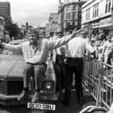 British businessman Richard Branson poses with his pink Pontiac car outside his new Virgin Megastore, opening in Edinburgh in July 1990.