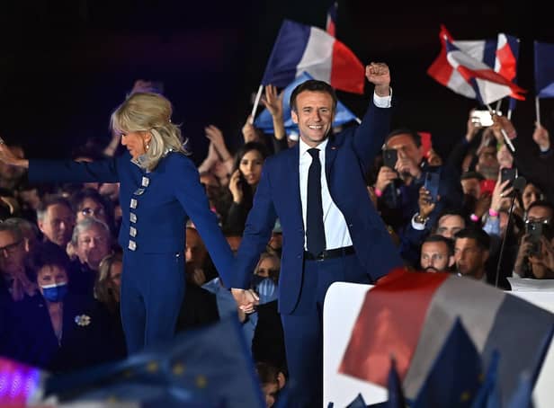 France's President Emmanuel Macron and his wife Brigitte Macron celebrate his re-election (Picture: Aurelien Meunier/Getty Images)