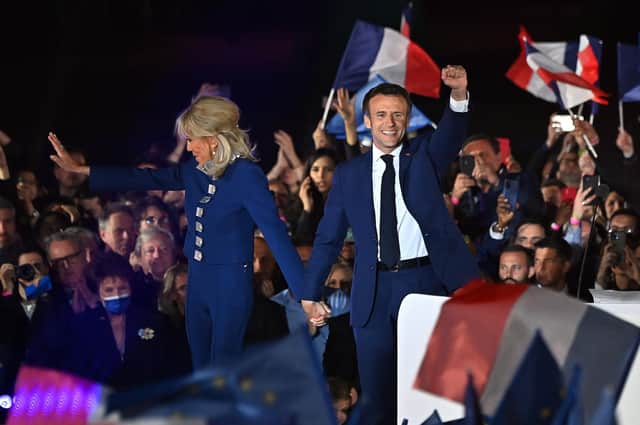France's President Emmanuel Macron and his wife Brigitte Macron celebrate his re-election (Picture: Aurelien Meunier/Getty Images)