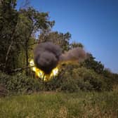 Ukrainian troops fire with howitzer words Russian lines (Picture: Anatolii Stepanov/AFP via Getty Images)