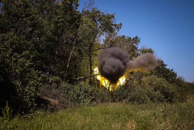 Ukrainian troops fire with howitzer words Russian lines (Picture: Anatolii Stepanov/AFP via Getty Images)