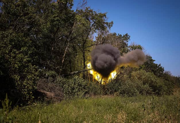 Ukrainian troops fire with howitzer words Russian lines (Picture: Anatolii Stepanov/AFP via Getty Images)