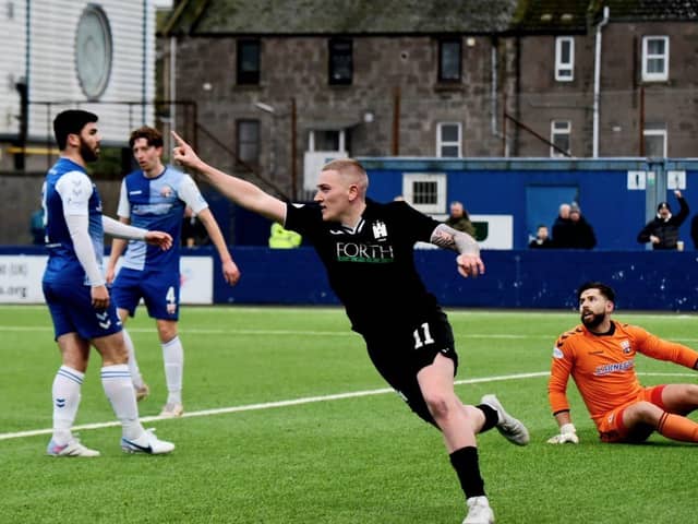 John Robertson celebrates putting Edinburgh in front. Picture: Tommy Lee