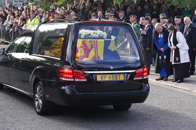 The hearse carrying the coffin of Queen Elizabeth II, draped with the Royal Standard of Scotland (Andrew Milligan/PA Wire)