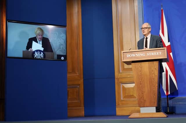 Boris Johnson appears on a screen from Chequers, where he is self-isolating, during a Covid media briefing with chief scientific adviser Sir Patrick Vallance (Picture: Alberto Pezzali/PA)