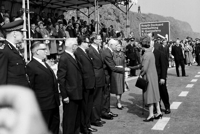 Queen Elizabeth II shakes hands with Sheriff Lillie in Fife,  as she officially opens the Forth Road bridge in September 1964.