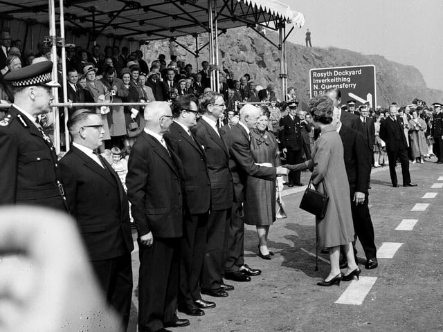 Queen Elizabeth II shakes hands with Sheriff Lillie in Fife, as she officially opens the Forth Road bridge in September 1964.