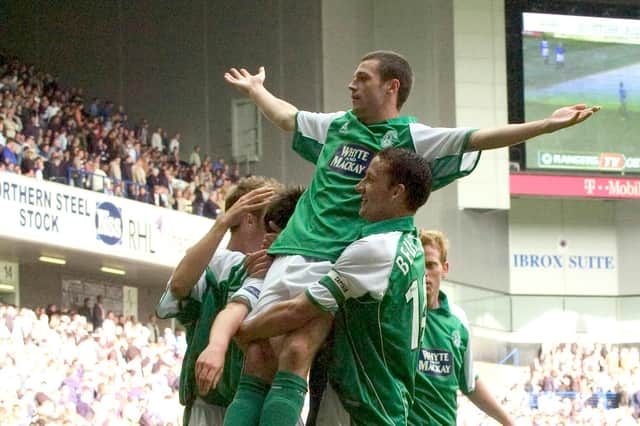 Ivan Sproule rejoices with his Hibs team-mates after completing his hat-trick in the 3-0 win over Rangers at Ibrox on August 27, 2005. Pic: SNS Group Craig Watson