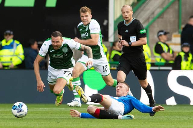 John Lundstram is shown a straight red card for this tackle on Martin Boyle during the 2-2 draw between Hibs and Rangers at Easter Road. Picture: SNS