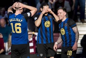 Hearts team-mates Andy Halliday and Peter Haring act stunned after Barrie McKay scored his first goal for the club against Livingston. Picture: SNS
