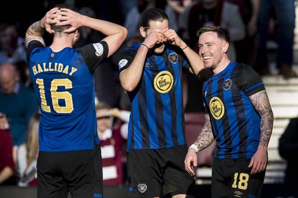 Hearts team-mates Andy Halliday and Peter Haring act stunned after Barrie McKay scored his first goal for the club against Livingston. Picture: SNS