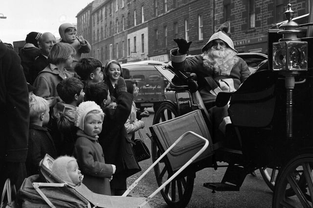 Santa Claus arrives at St Cuthbert's Co-operative Society in Bread Street.