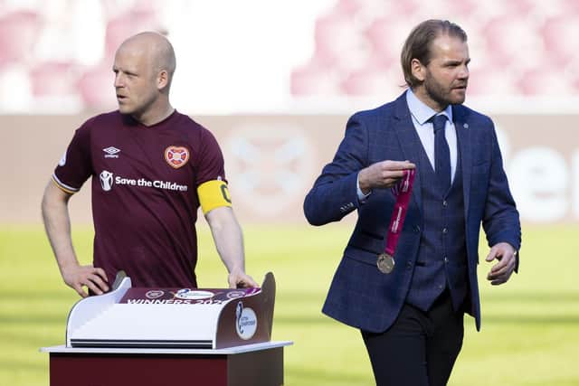 Steven Naismith played for Robbie Neilson (right) during the Championship season before becoming part of his coaching staff. Picture: SNS