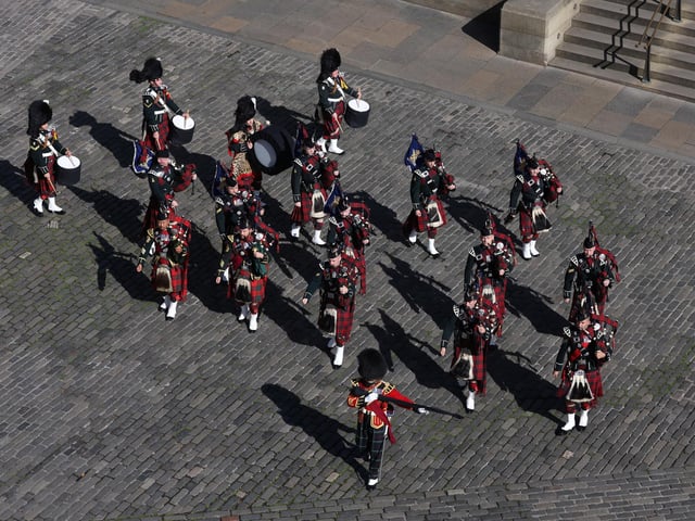 Members of a band march outside St Giles' Cathedral, Edinburgh, ahead of a Service of Prayer and Reflection for the Life of Queen Elizabeth II.