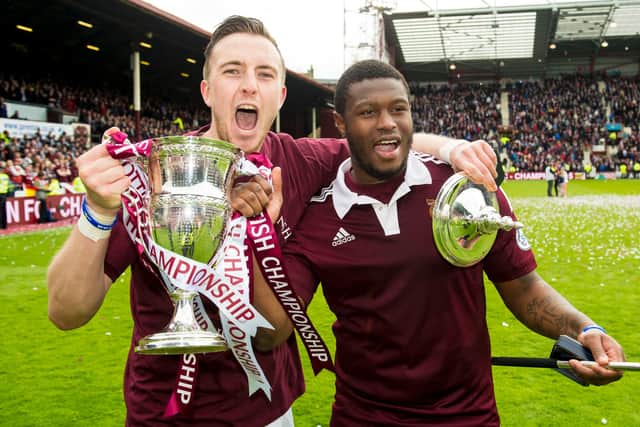 Hearts captain Danny Wilson (left) and Genero Zeefuik celebrate with the Scottish Championship trophy.