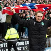 Elias Melkersen holds a Norwegian flag in front of the away end at Fir Park after scoring twice to help Hibs defeat Motherwell. Picture: SNS