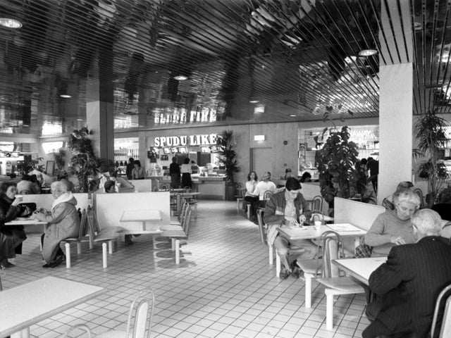 Shoppers in the Food Court (Spud U Like baked potato shop in background) of the newly-opened Cameron Toll shopping centre in Edinburgh, April 1985.