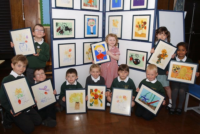 Hillview Infant School pupils held a fundraising art exhibition in 2006 and here they are with their designs. Recognise anyone?