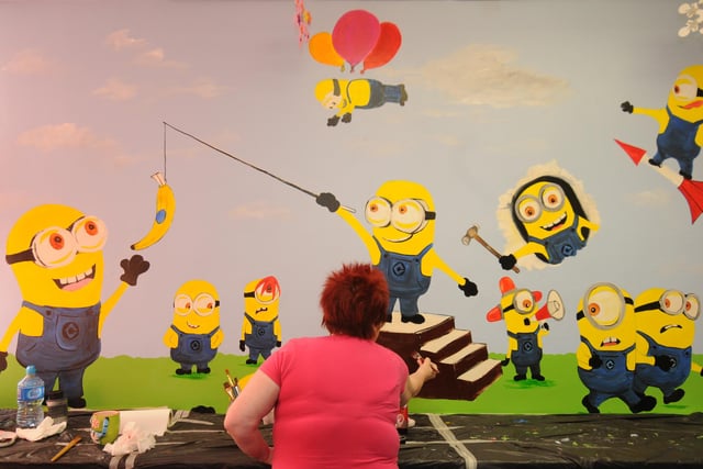 Newcastle fans put the finishing touches to a giant wall mural on the children's paediatric ward at Sunderland Royal Hospital as a way of saying thanks to the Sunderland supporters for their fund-raising in 2014.