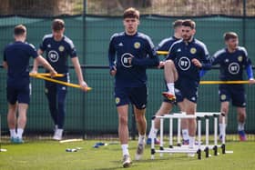 Aaron Hickey trains with Scotland on Tuesday but he is a doubt for the Poland fixture due to feeling unwell.