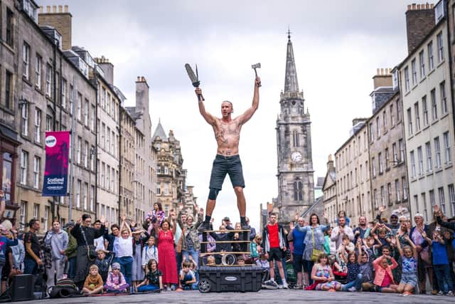 Circus street artist 'Reidiculous' performs for the Fringe crowds on the Royal Mile. Picture: Jane Barlow/PA Wire